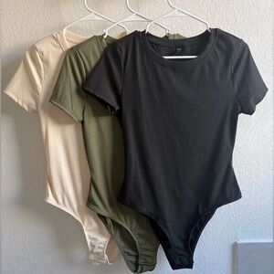 Set of Three Ribbed Bodysuits in Black, Olive, and Cream